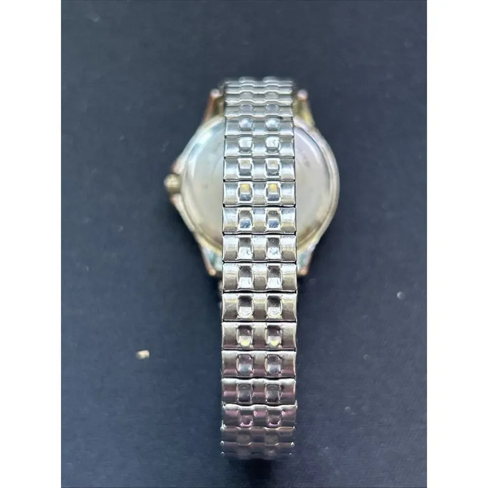 Sutton Silver Tone Worn Bronze Tone Bezel Women’s Stretch Band Quartz Watch